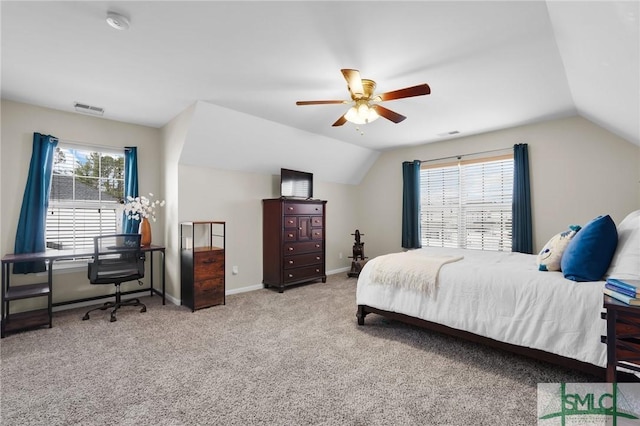 carpeted bedroom featuring ceiling fan, baseboards, visible vents, and vaulted ceiling