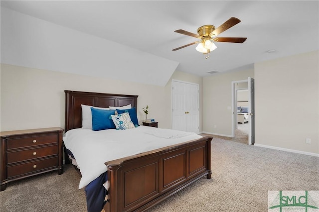 carpeted bedroom featuring a ceiling fan, visible vents, and baseboards