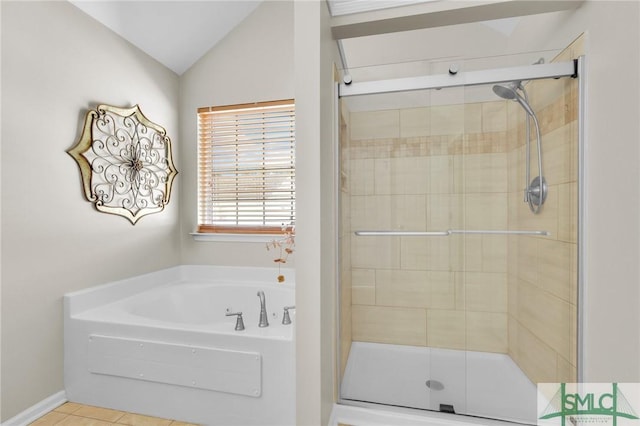 full bath featuring a shower stall, vaulted ceiling, a bath, and tile patterned floors