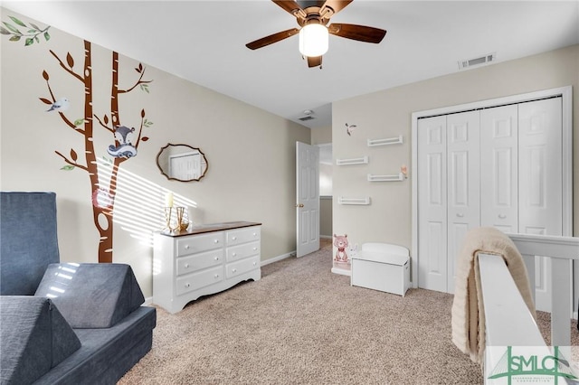 bedroom featuring visible vents, baseboards, a ceiling fan, carpet, and a closet