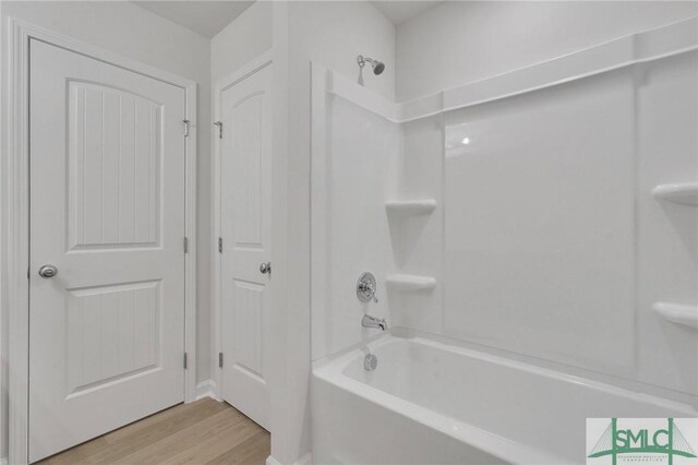 176 Orkney Rd, Savannah, GA 31407 - bathroom with tub / shower combination and wood finished floors