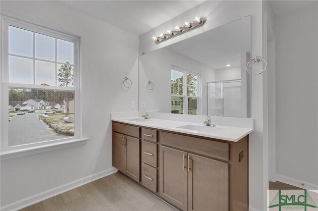 176 Orkney Rd, Savannah, GA 31407 - bathroom featuring a sink, a shower stall, baseboards, and double vanity