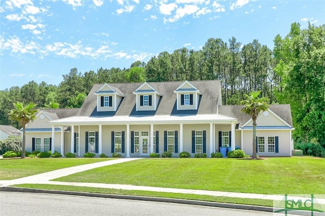 view of front of home with french doors and a front yard