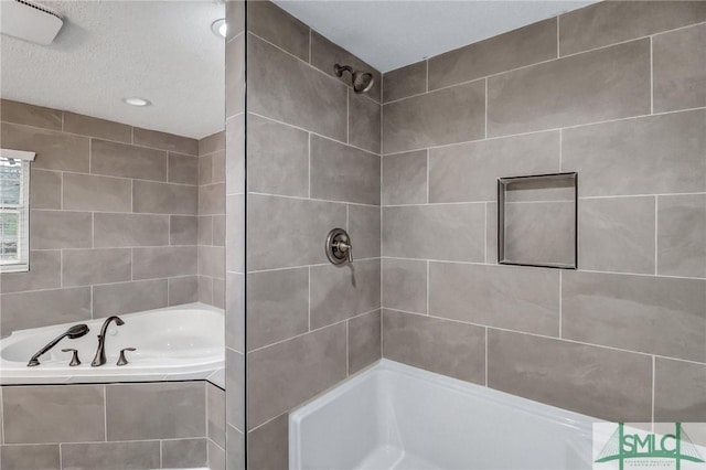 full bath featuring a garden tub and a tile shower