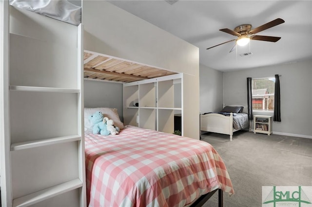 bedroom featuring ceiling fan, carpet flooring, and baseboards