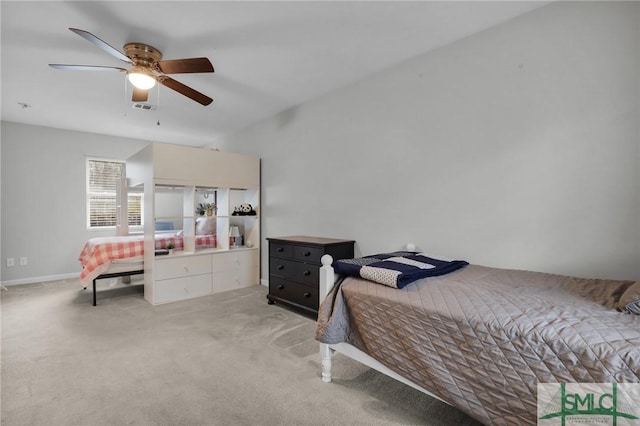 bedroom featuring light colored carpet, visible vents, and ceiling fan