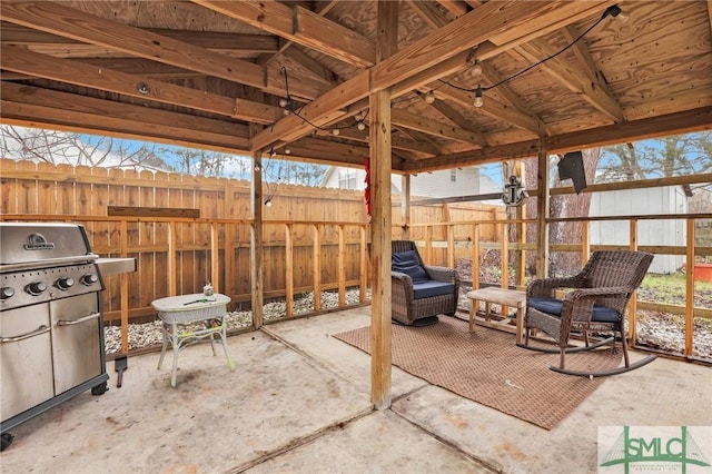 view of patio / terrace with grilling area and fence