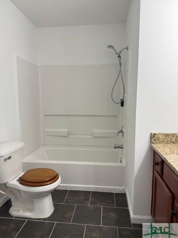 bathroom with baseboards, toilet, tile patterned flooring, bathtub / shower combination, and vanity