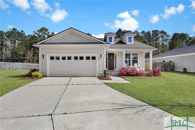 80 Rimmon Ct, Richmond Hill, GA 31324 - view of front of property featuring driveway, a front lawn, an attached garage, and fence