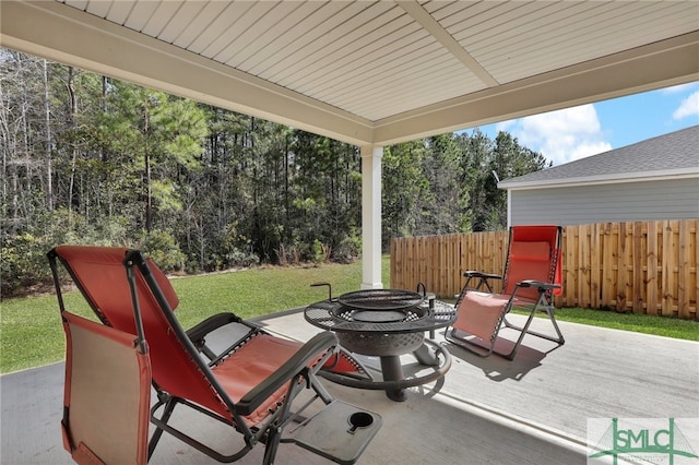 80 Rimmon Ct, Richmond Hill, GA 31324 - view of patio featuring fence and a fire pit
