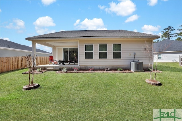 80 Rimmon Ct, Richmond Hill, GA 31324 - rear view of property featuring a yard, a patio area, fence, and central air condition unit