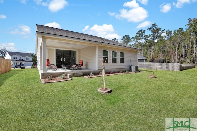 80 Rimmon Ct, Richmond Hill, GA 31324 - back of property featuring a yard, central AC, fence, and a patio