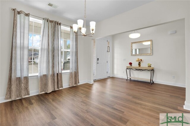 80 Rimmon Ct, Richmond Hill, GA 31324 - entrance foyer featuring wood finished floors, visible vents, and baseboards