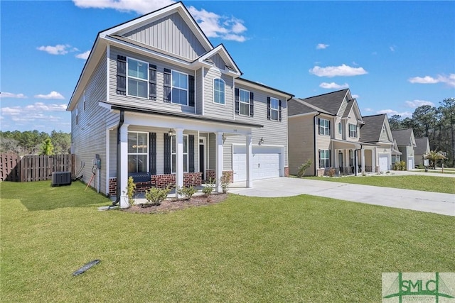 view of front of home featuring driveway, an attached garage, fence, board and batten siding, and a front yard