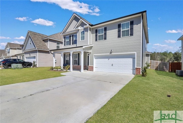 view of front of property featuring an attached garage, fence, concrete driveway, and a front yard