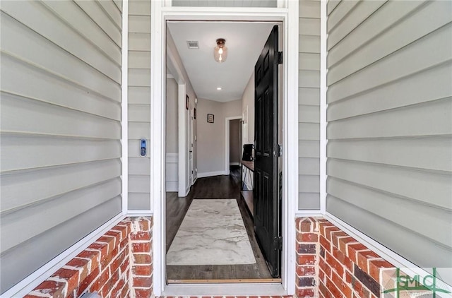 doorway to property with visible vents