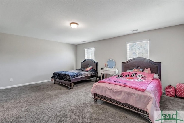 bedroom featuring carpet floors, visible vents, and baseboards