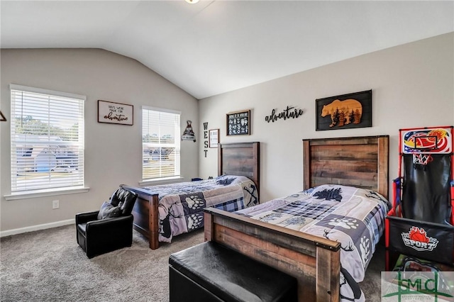 bedroom with carpet floors, baseboards, and vaulted ceiling