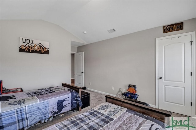 carpeted bedroom featuring vaulted ceiling, visible vents, and baseboards