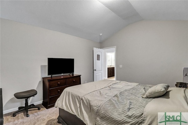 bedroom featuring light carpet, baseboards, and vaulted ceiling