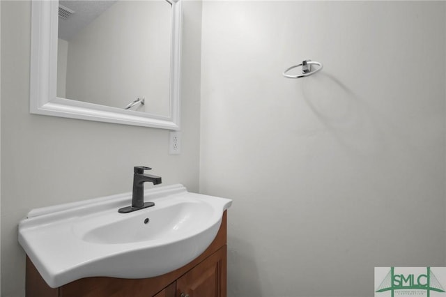 bathroom featuring visible vents and vanity