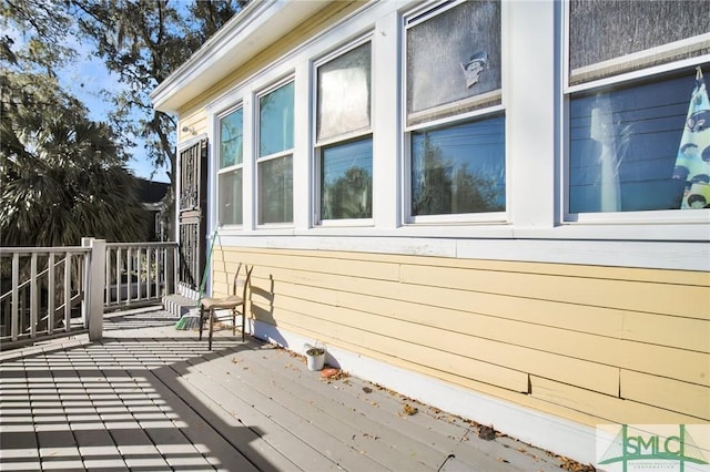 view of side of property with a wooden deck