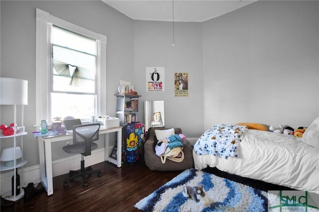 bedroom with wood finished floors