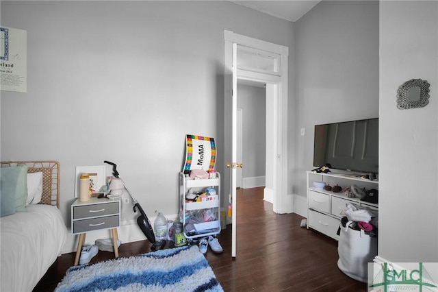 bedroom featuring wood finished floors