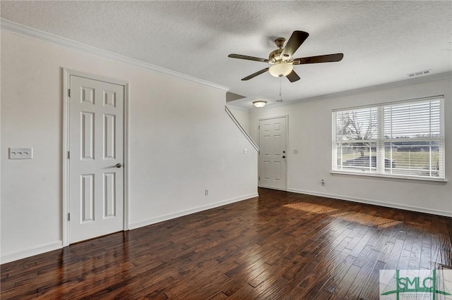 unfurnished living room with a textured ceiling, ornamental molding, hardwood / wood-style flooring, and visible vents