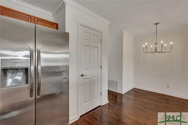 kitchen featuring dark wood-style flooring, crown molding, visible vents, a textured ceiling, and stainless steel fridge with ice dispenser