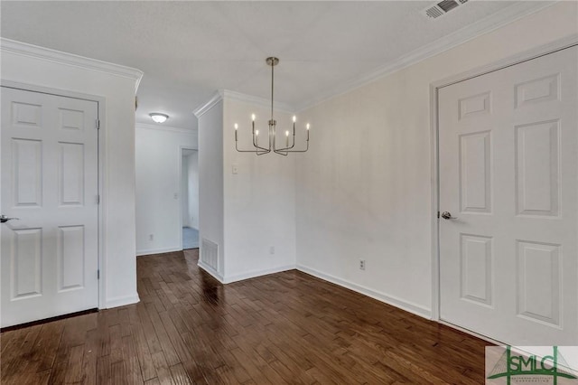 unfurnished dining area featuring dark wood-style floors, baseboards, visible vents, and crown molding