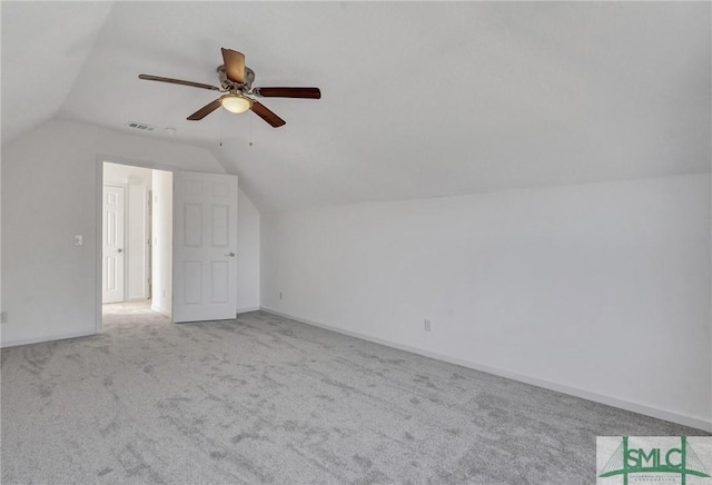 bonus room featuring baseboards, visible vents, lofted ceiling, ceiling fan, and carpet floors