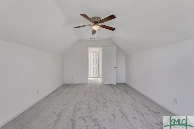 bonus room featuring carpet floors, visible vents, a ceiling fan, vaulted ceiling, and baseboards