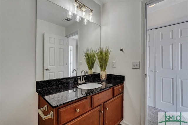 bathroom featuring visible vents and vanity