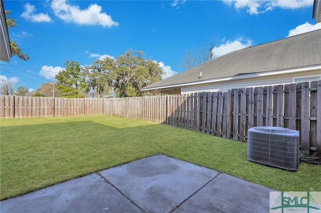 view of yard with central AC, a patio area, and a fenced backyard