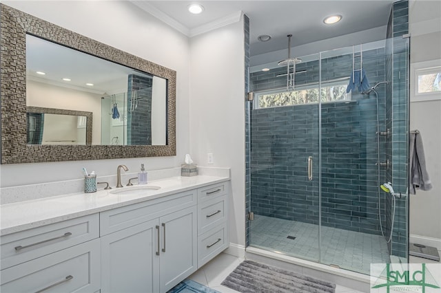 bathroom with recessed lighting, a stall shower, crown molding, and vanity