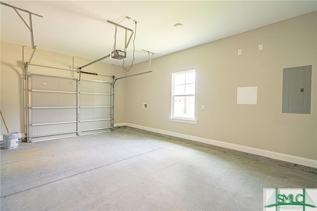 garage with a garage door opener, electric panel, and baseboards