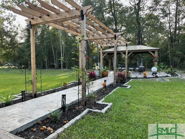 view of yard featuring a gazebo, a patio area, and a pergola