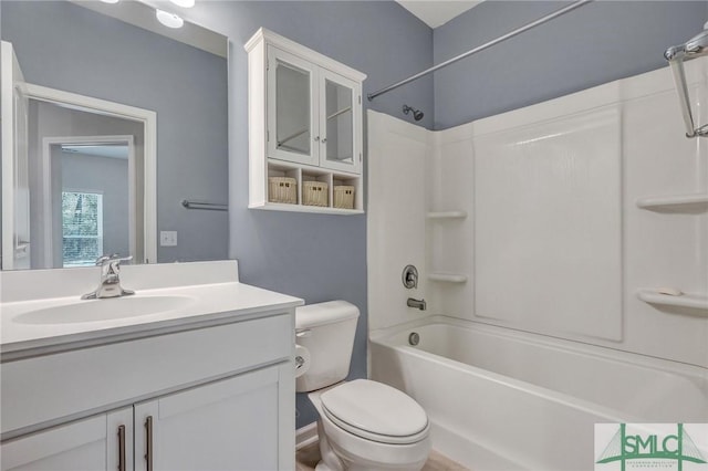 bathroom with vanity, toilet, and shower / bathtub combination