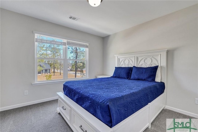 bedroom featuring visible vents, baseboards, and carpet floors