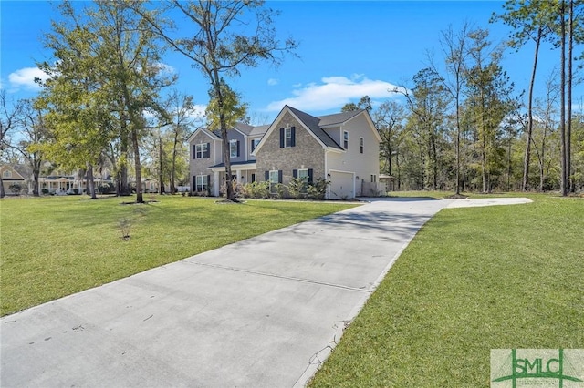 view of front facade featuring a front yard, stone siding, a garage, and driveway