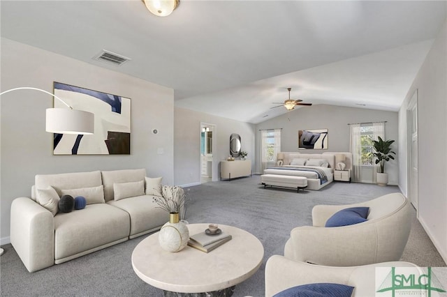 living area with carpet, baseboards, visible vents, ceiling fan, and vaulted ceiling