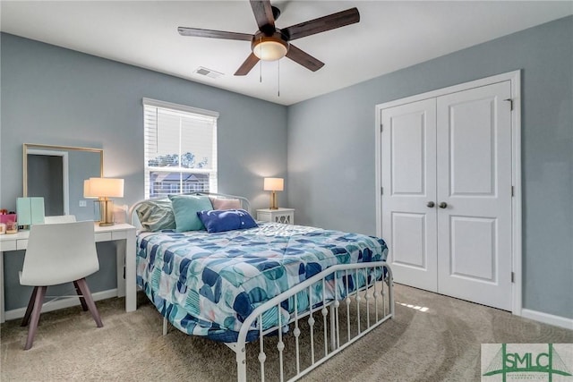 bedroom with carpet, a closet, visible vents, ceiling fan, and baseboards