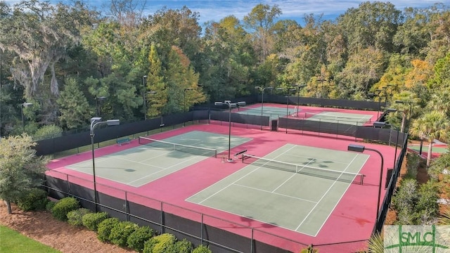 view of sport court featuring fence