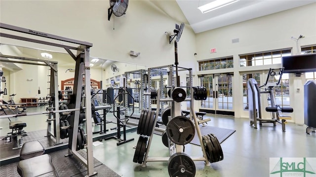 workout area with a high ceiling