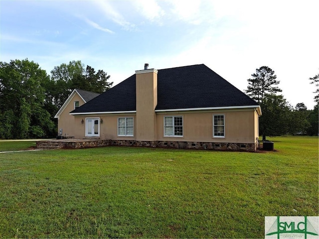 view of front of house with crawl space, a chimney, and a front lawn