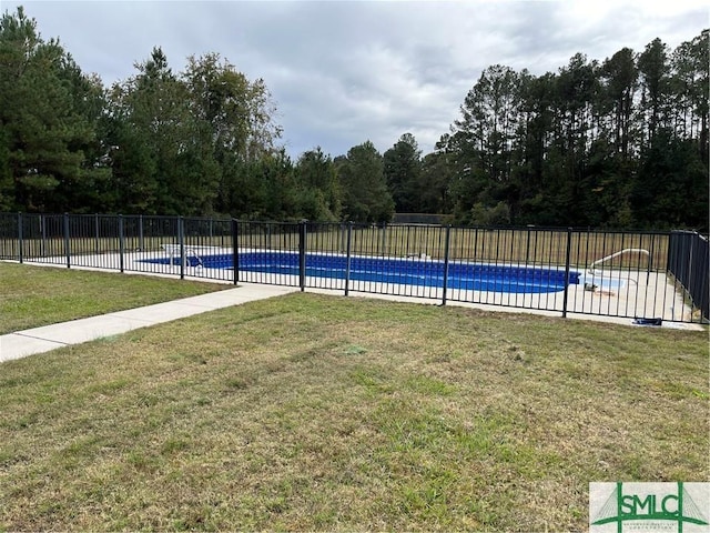 view of pool with a yard, fence, and a fenced in pool