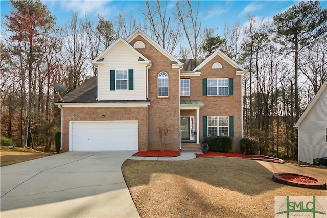 view of front facade featuring brick siding, driveway, and an attached garage