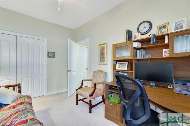 office space featuring light colored carpet and baseboards