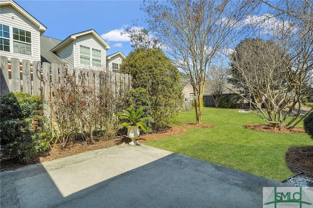 view of yard featuring a patio area and fence